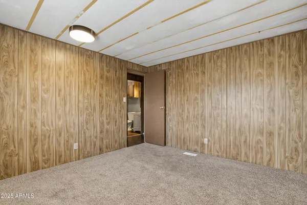a view of a big room with wooden walls