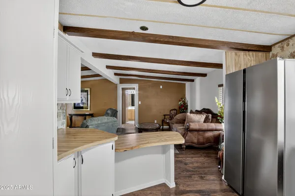 a living room with granite countertop furniture and a fireplace