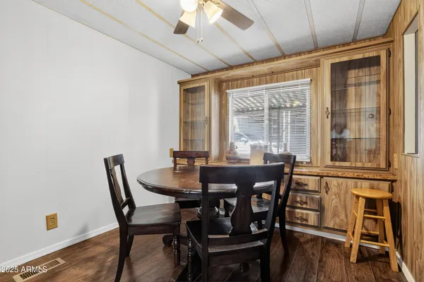 a view of a dining room with furniture and wooden floor