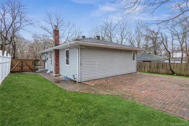 a view of a backyard with a large tree