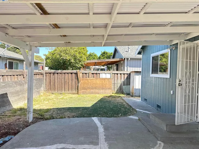 a view of a backyard with a small cabin