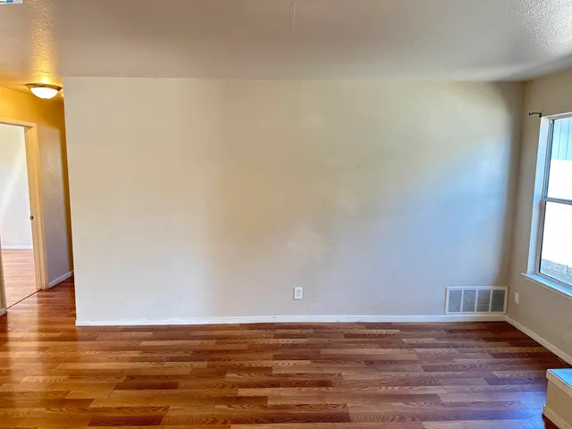 a view of an empty room and window