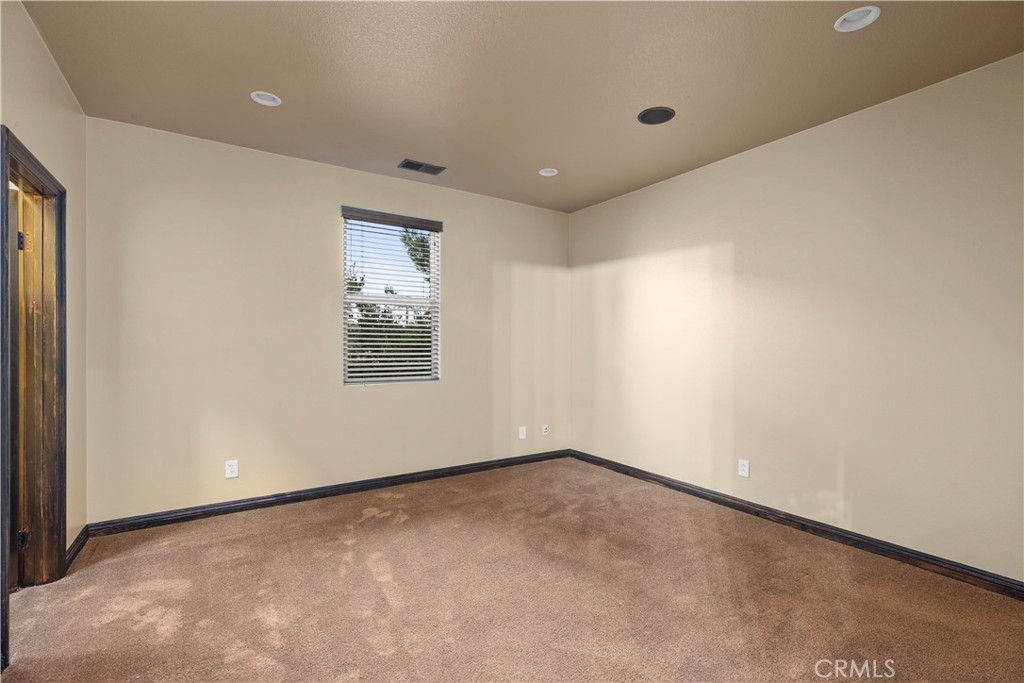 18301 Lakepointe Drive Riverside, CA 92503 - Photo 36 of 67 a view of an empty room with a window