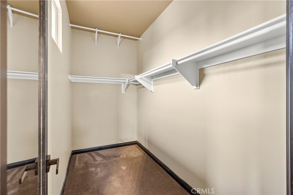 18301 Lakepointe Drive Riverside, CA 92503 - Photo 39 of 67 a view of walk in closet with empty racks