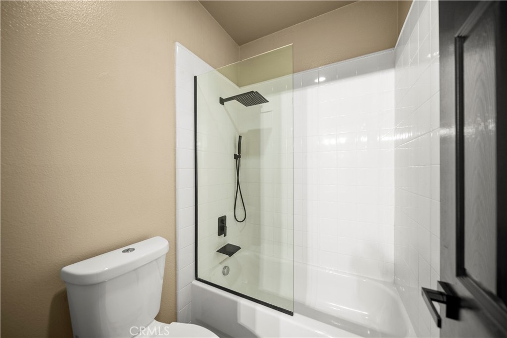 18301 Lakepointe Drive Riverside, CA 92503 - Photo 41 of 67 a bathroom with a shower and a toilet