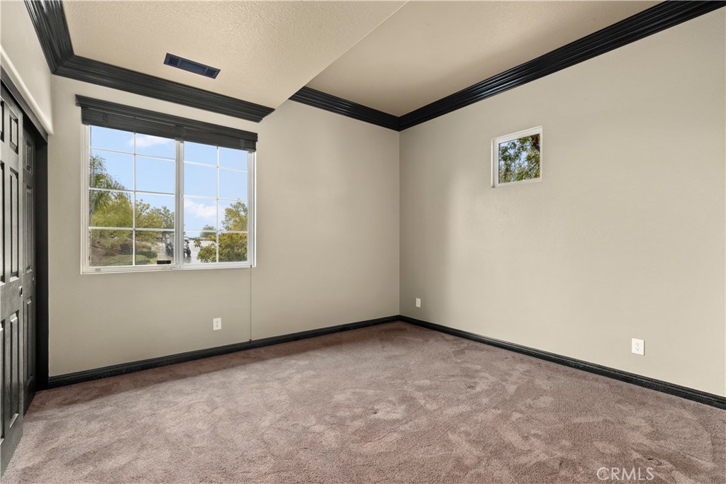 18301 Lakepointe Drive Riverside, CA 92503 - Photo 46 of 67 a view of an empty room with a window