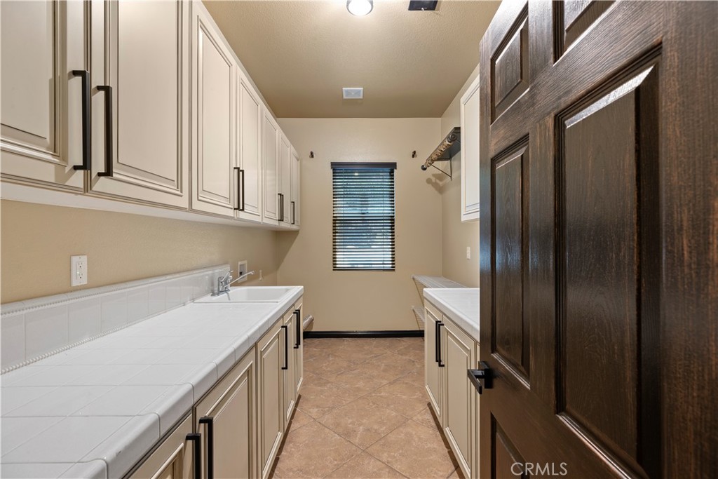 18301 Lakepointe Drive Riverside, CA 92503 - Photo 49 of 67 a storage room with a sink