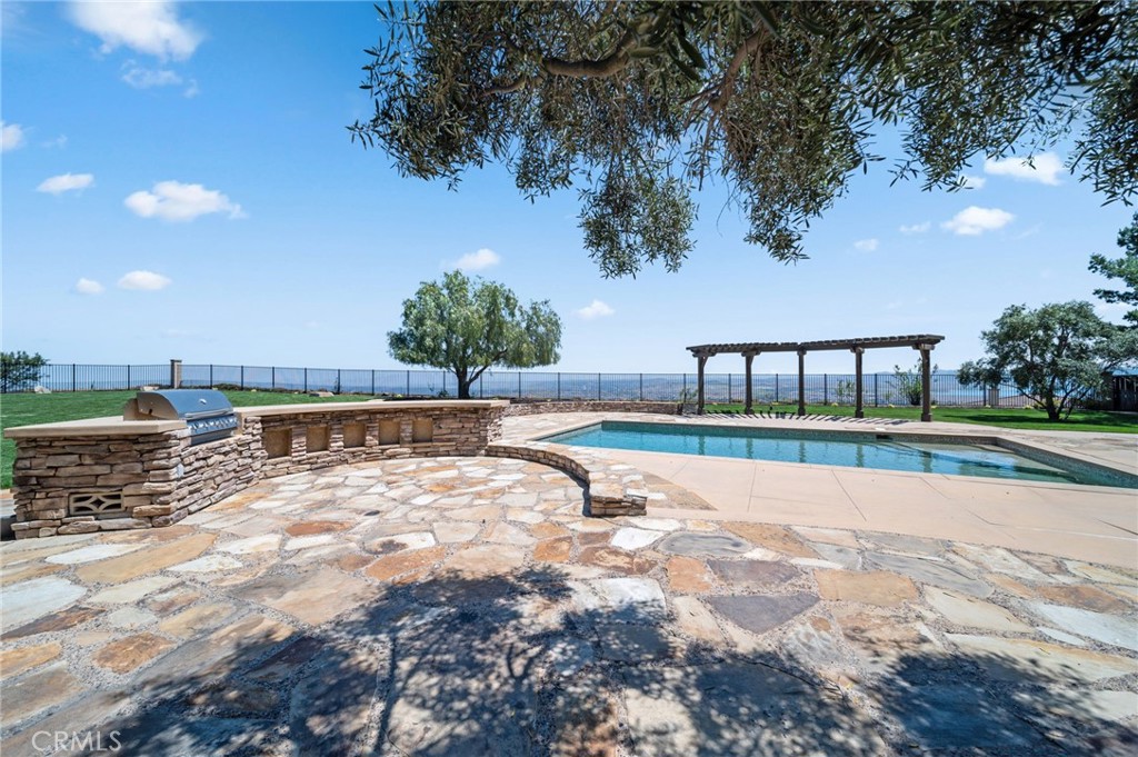 18301 Lakepointe Drive Riverside, CA 92503 - Photo 57 of 67 a view of swimming pool with outdoor seating and yard