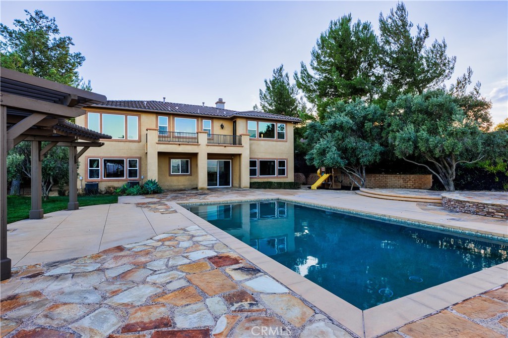 18301 Lakepointe Drive Riverside, CA 92503 - Photo 62 of 67 a front view of a house with swimming pool