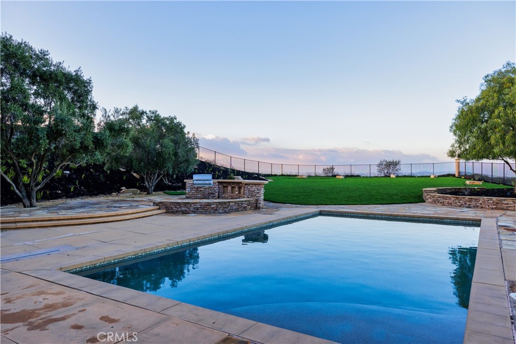 18301 Lakepointe Drive Riverside, CA 92503 - Photo 63 of 67 a view of a swimming pool and a yard
