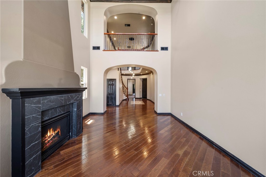 18301 Lakepointe Drive Riverside, CA 92503 - Photo 7 of 67 a view of livingroom with fireplace wooden floor and a window
