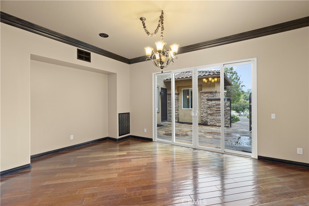 18301 Lakepointe Drive Riverside, CA 92503 - Photo 9 of 67 a view of a livingroom with wooden floor and a ceiling fan