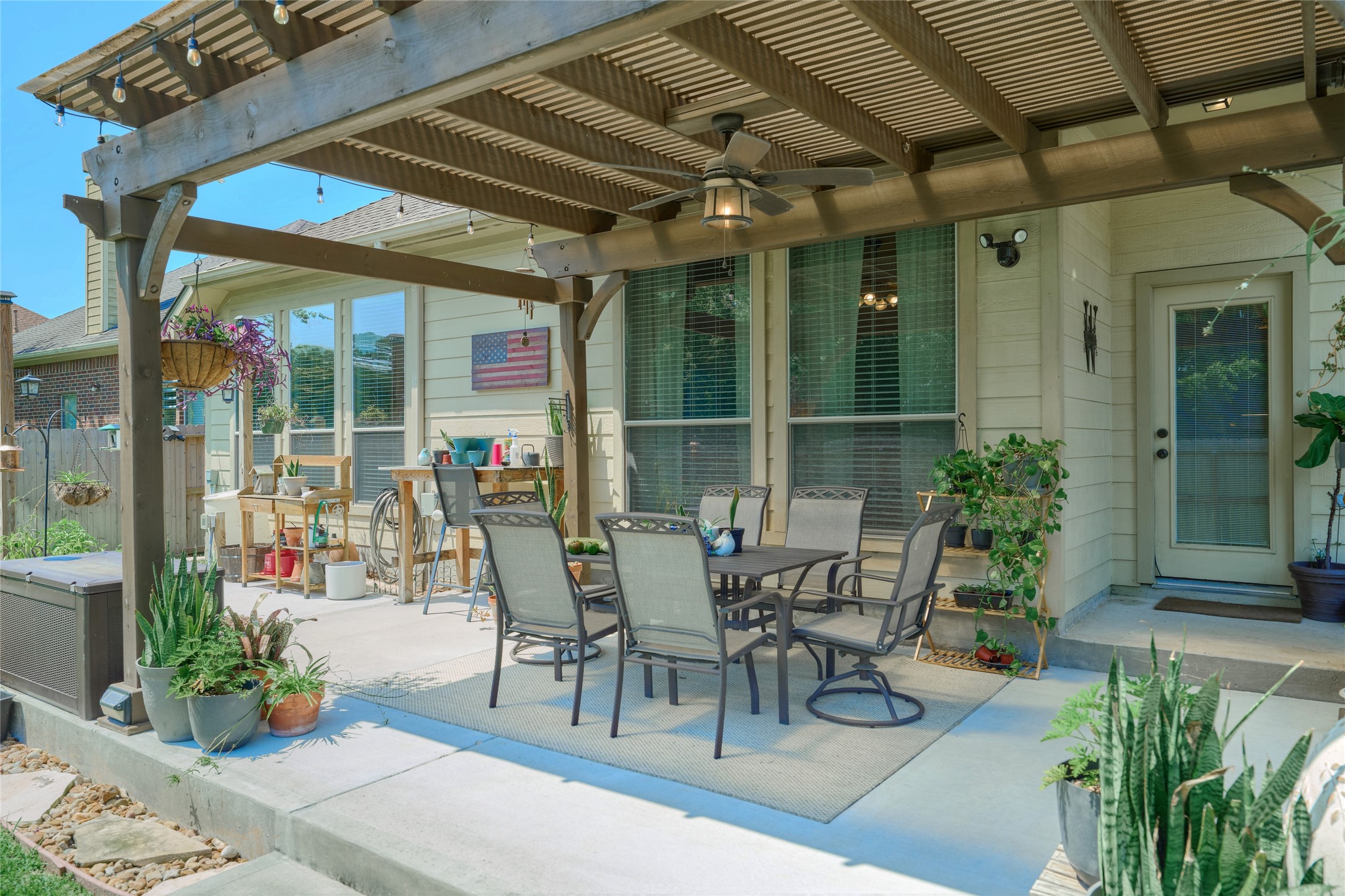 28322 Madelin Manor Lane Spring, TX 77386 - Photo 37 of 46 a view of a patio with table and chairs potted plants