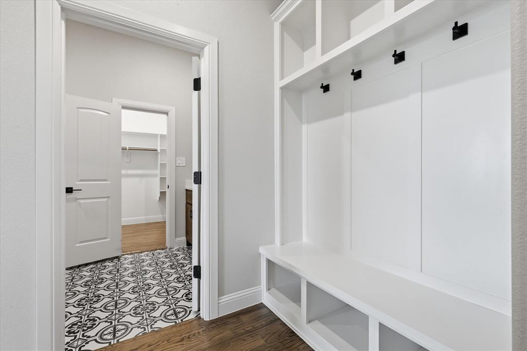 120 Grace Vw Road Weatherford, TX 76088 - Photo 22 of 40 Built-in mudroom bench with storage cubbies and coat hooks, featuring a white finish