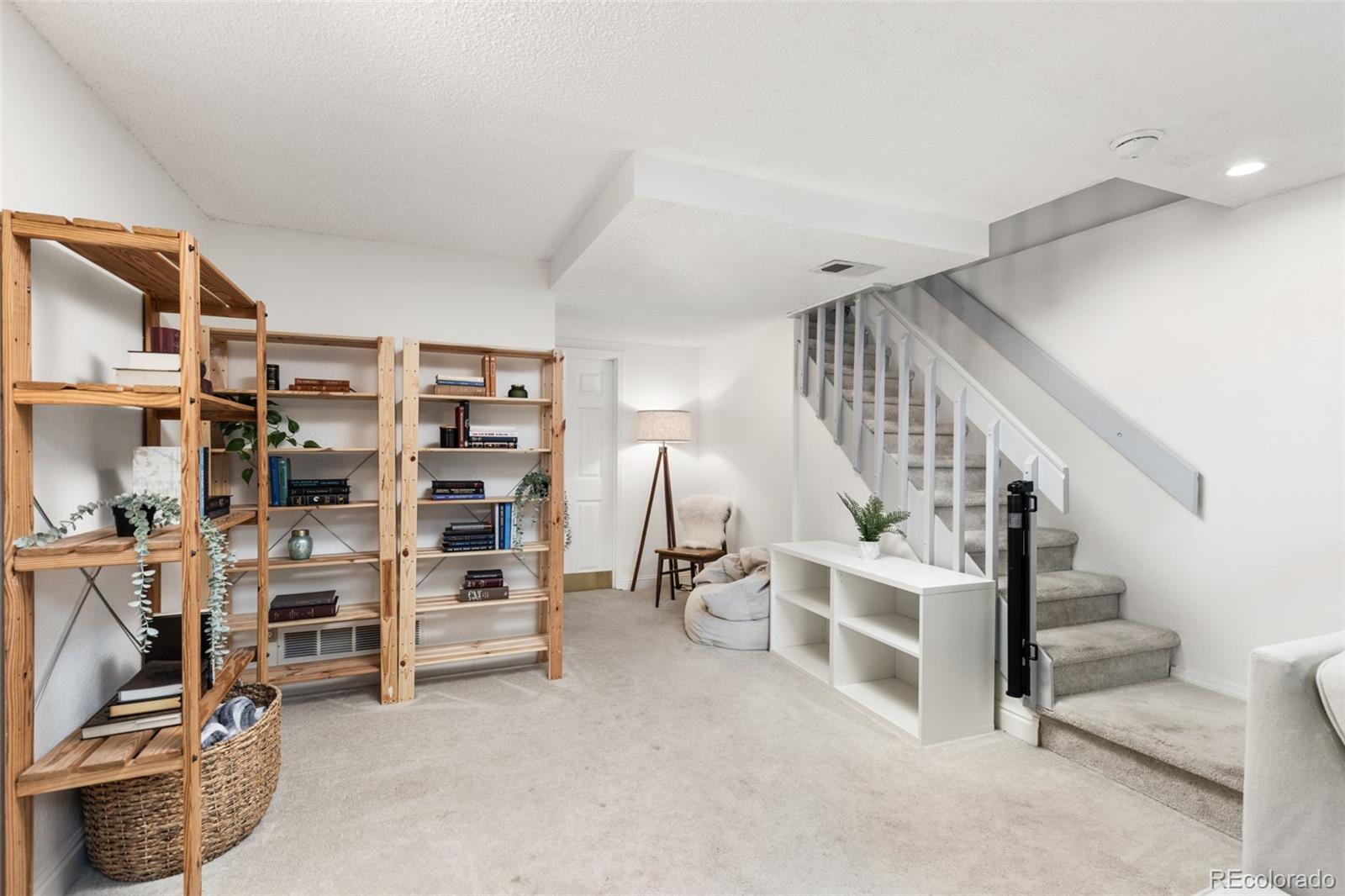 8228 South Fillmore Circle Centennial, CO 80122 - Photo 11 of 23 a view of a livingroom with furniture and staircase