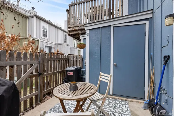 a view of a chair and table in the balcony