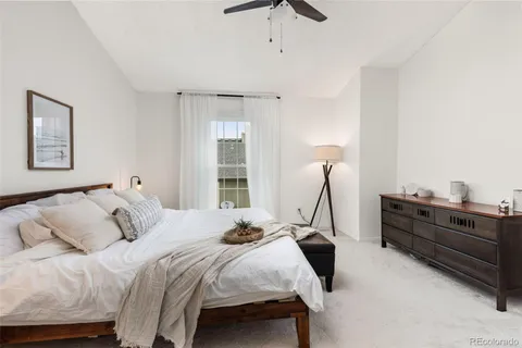 a bedroom with a bed and window