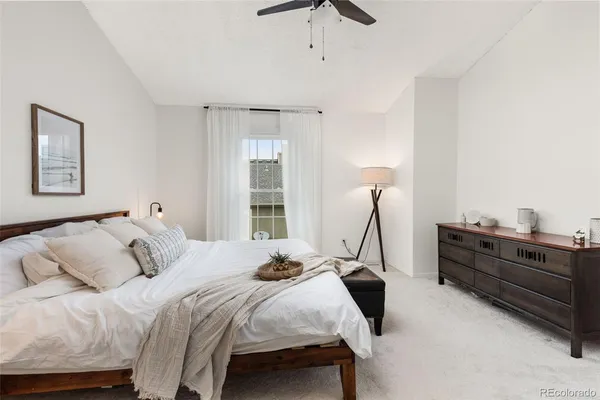 a bedroom with a bed and window