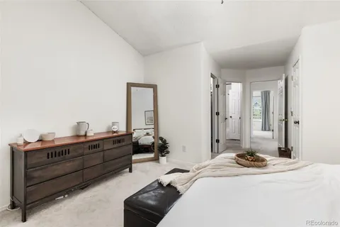 a bed room with a bed and a television