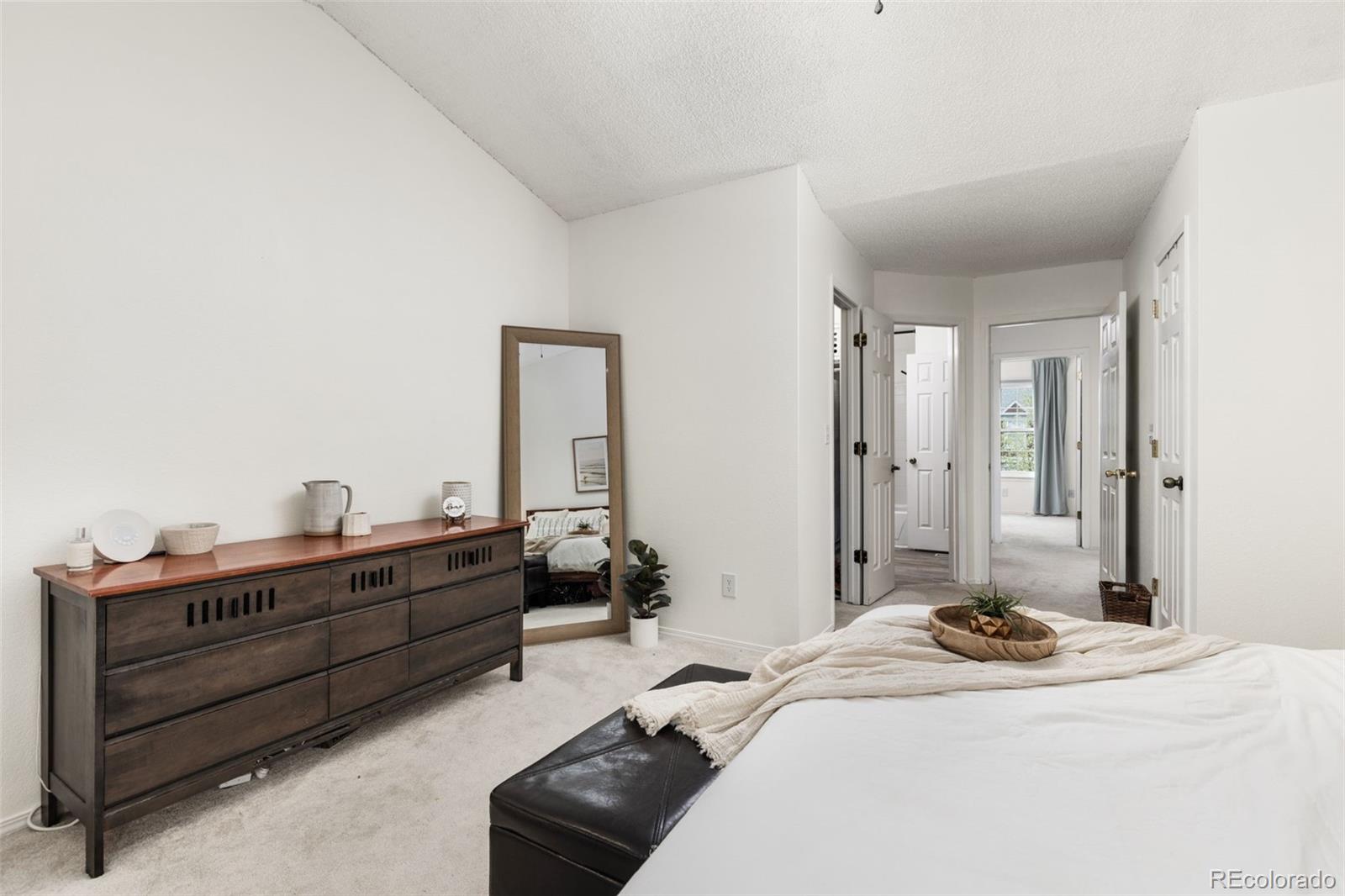 8228 South Fillmore Circle Centennial, CO 80122 - Photo 18 of 23 a bed room with a bed and a television