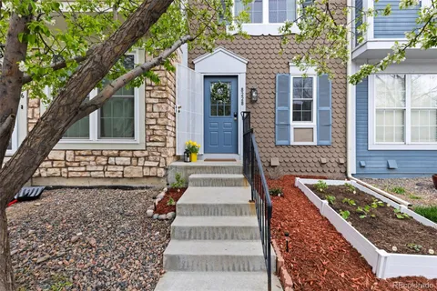 a front view of a house with stairs