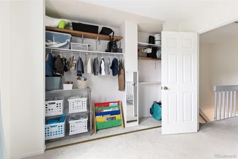 a utility room with multiple dryer and washer