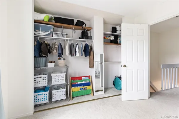 a utility room with multiple dryer and washer
