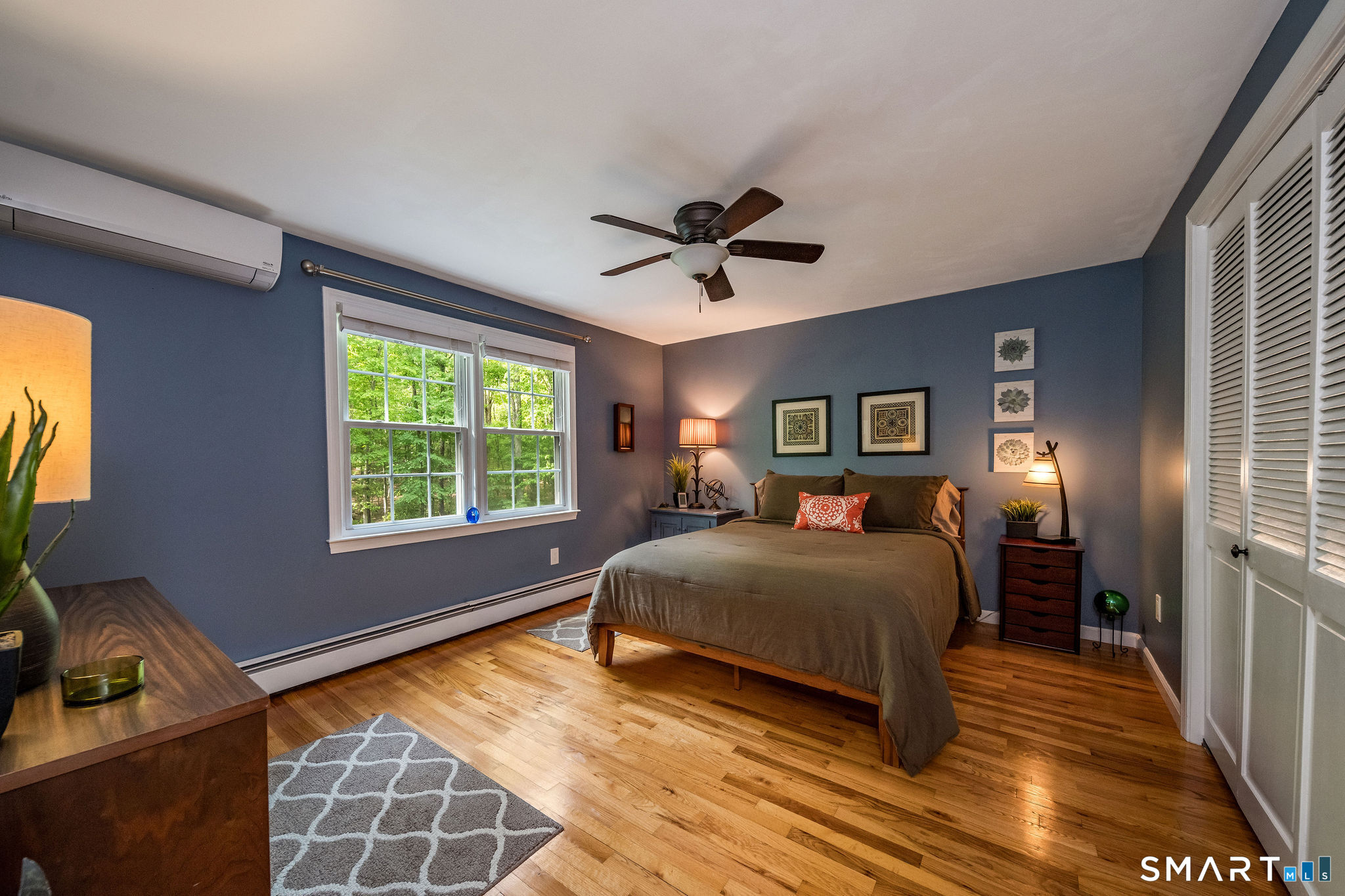 60 Bradley Corners Road Madison, CT 06443 - Photo 20 of 33 a bedroom with a bed and window