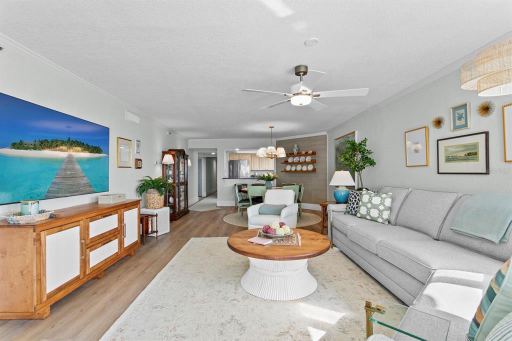 16332 Gulf Boulevard, Unit 3B Redington Beach, FL 33708 - Photo 34 of 91 a living room with furniture and a fireplace