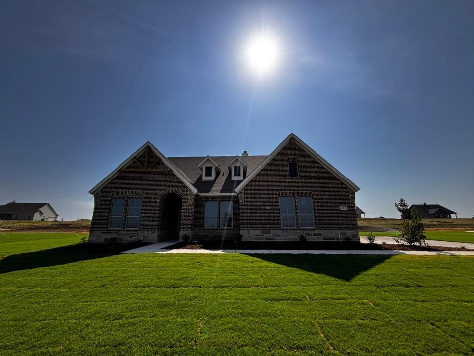 157 Big Sky Road Decatur, TX 76234 - Photo 1 of 13 Brick and stone exterior with gabled roofline and dormer windows