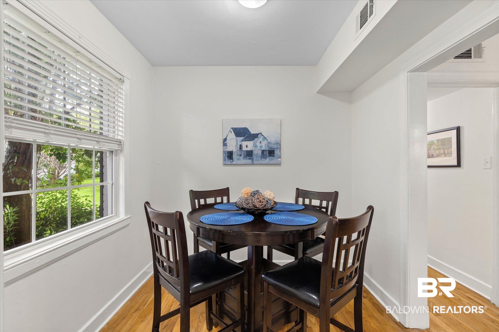 214 Upham Street, Unit 18A Mobile, AL 36607 - Photo 13 of 29 Dining room featuring baseboards and light wood finished floors