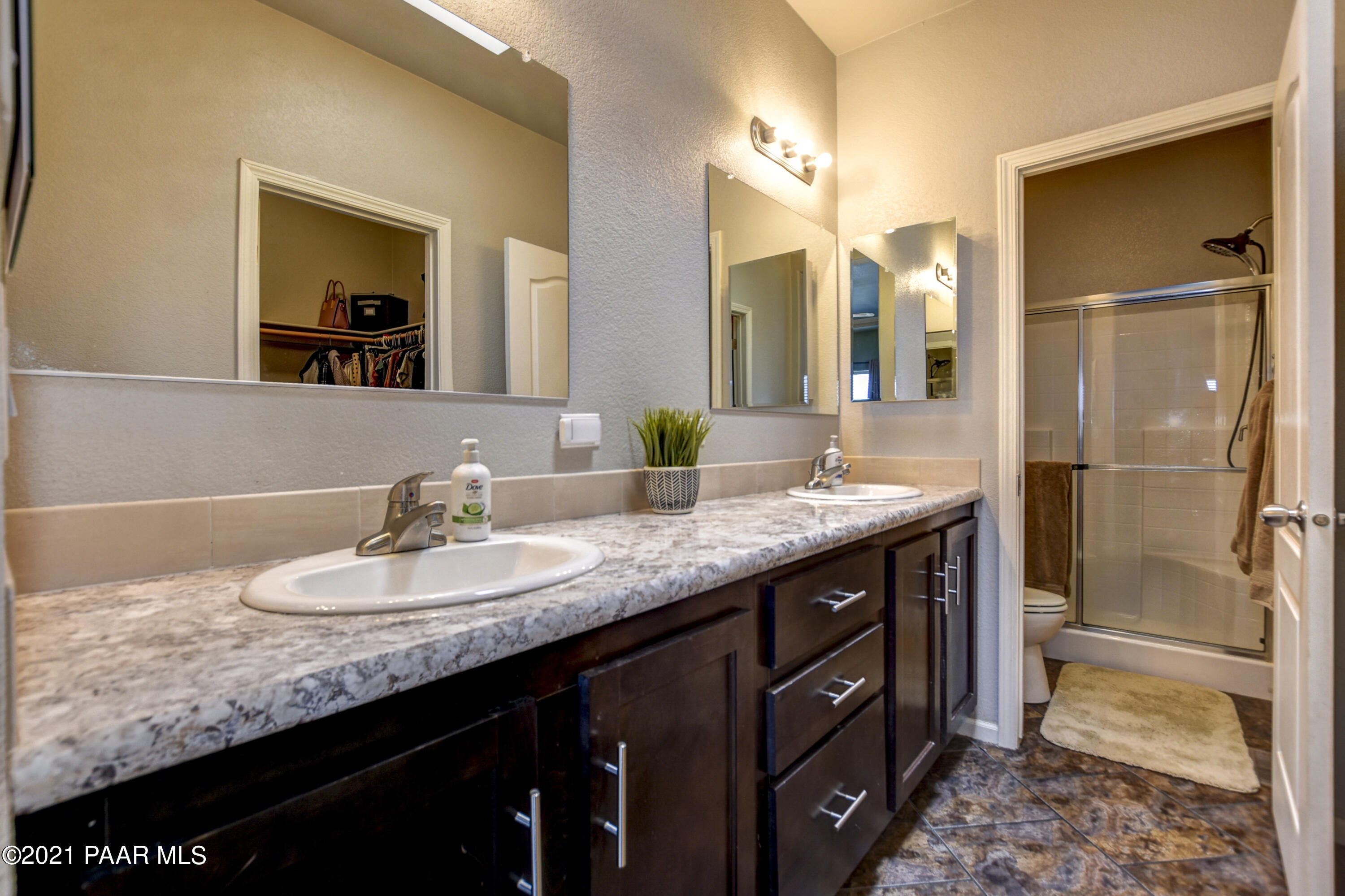 12301 North Poquito Valley Road Prescott Valley, AZ 86315 - Photo 11 of 31 a bathroom with a granite countertop sink and a mirror