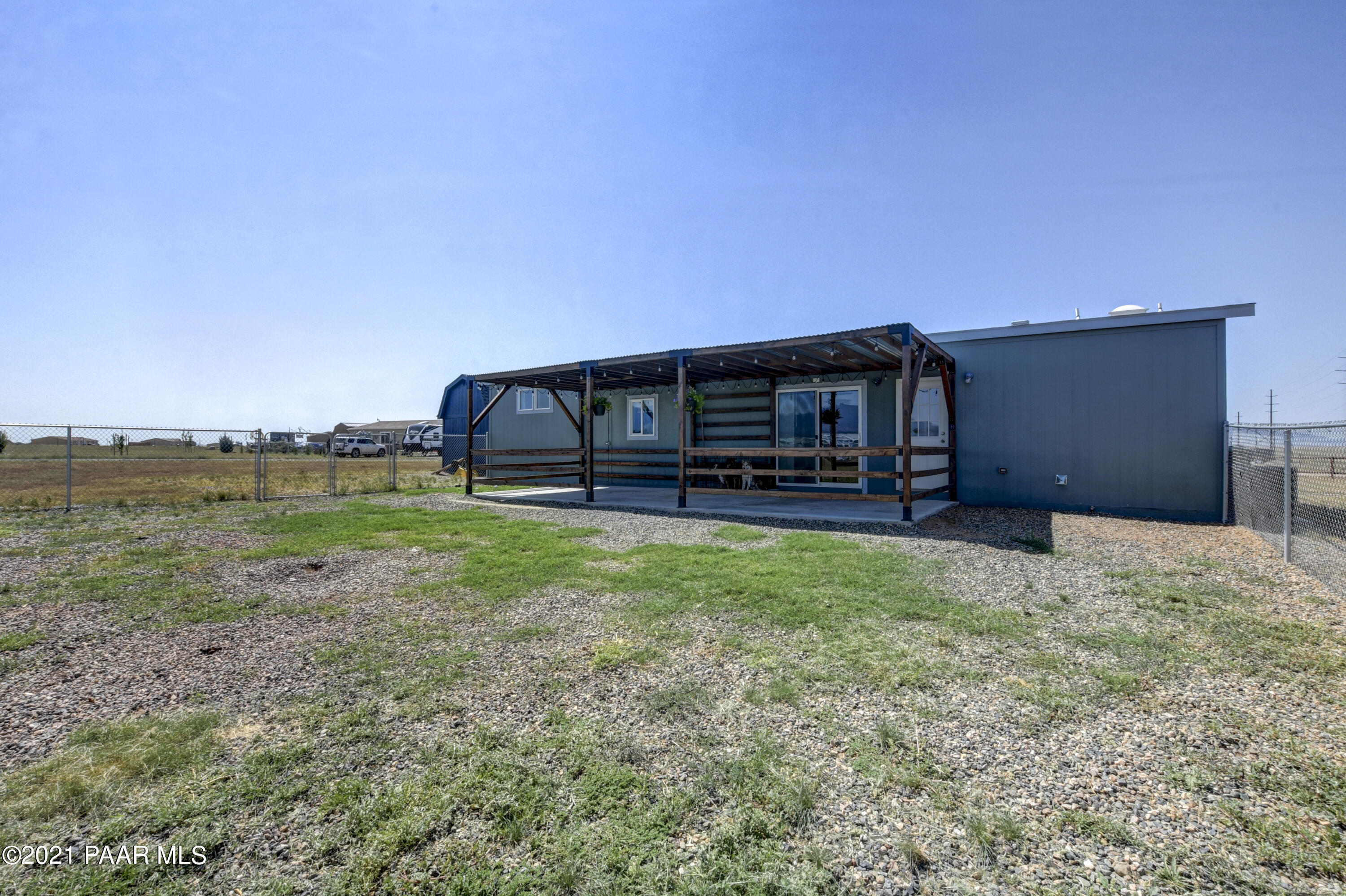 12301 North Poquito Valley Road Prescott Valley, AZ 86315 - Photo 20 of 31 a view of a house with backyard and a garden