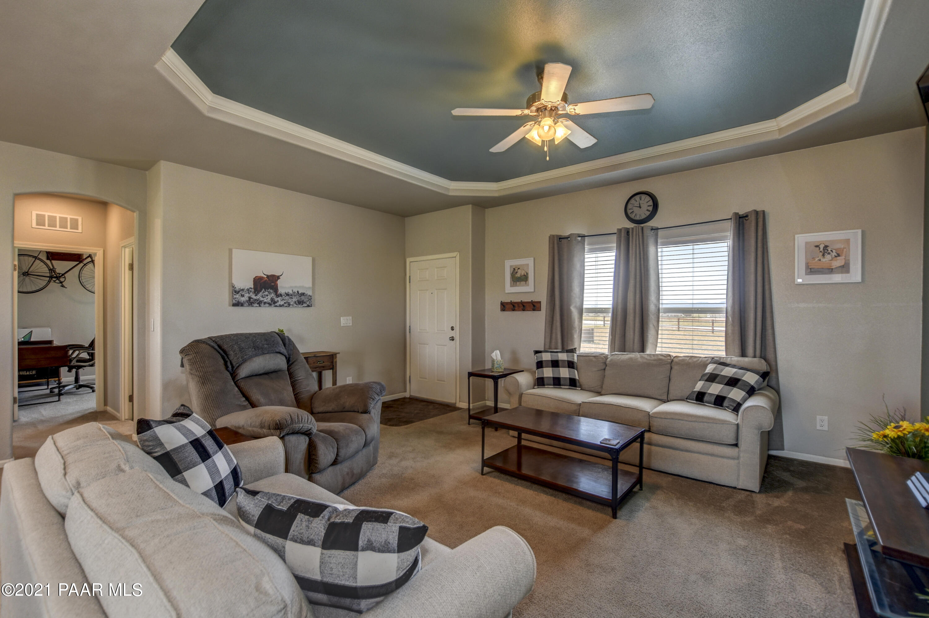 12301 North Poquito Valley Road Prescott Valley, AZ 86315 - Photo 2 of 31 a living room with furniture and a chandelier