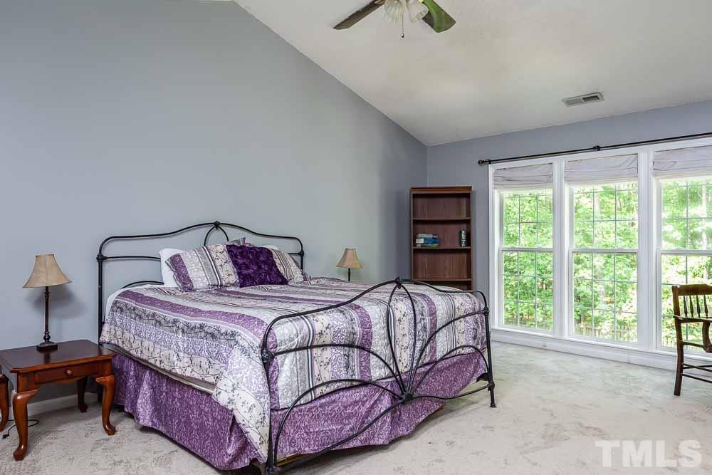 9501 Miranda Drive Raleigh, NC 27617 - Photo 15 of 30 Soaring cathedrals and abundant windows open this room wide!