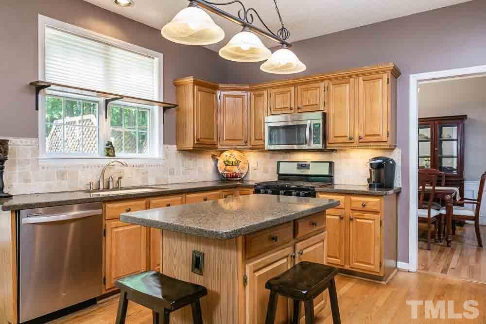 9501 Miranda Drive Raleigh, NC 27617 - Photo 7 of 30 The family who cooks together stays together! Plenty of room for everyone in this generous kitchen!