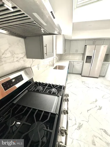 a view of kitchen and wooden floor