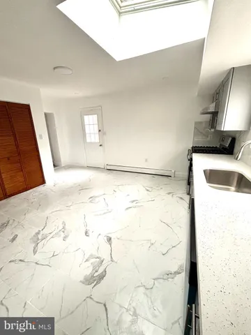 a view of a kitchen with a sink