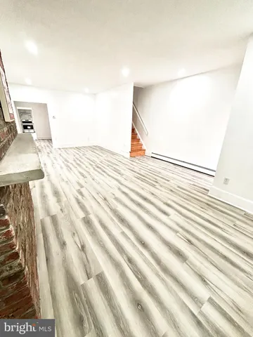 a view of a living room with a wooden floor