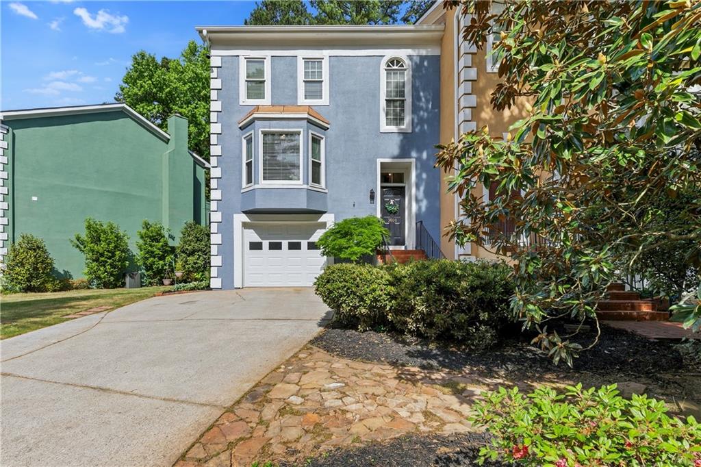 3800 Meeting Street Northwest Duluth, GA 30096 - Photo 1 of 46 a front view of a house with a garden