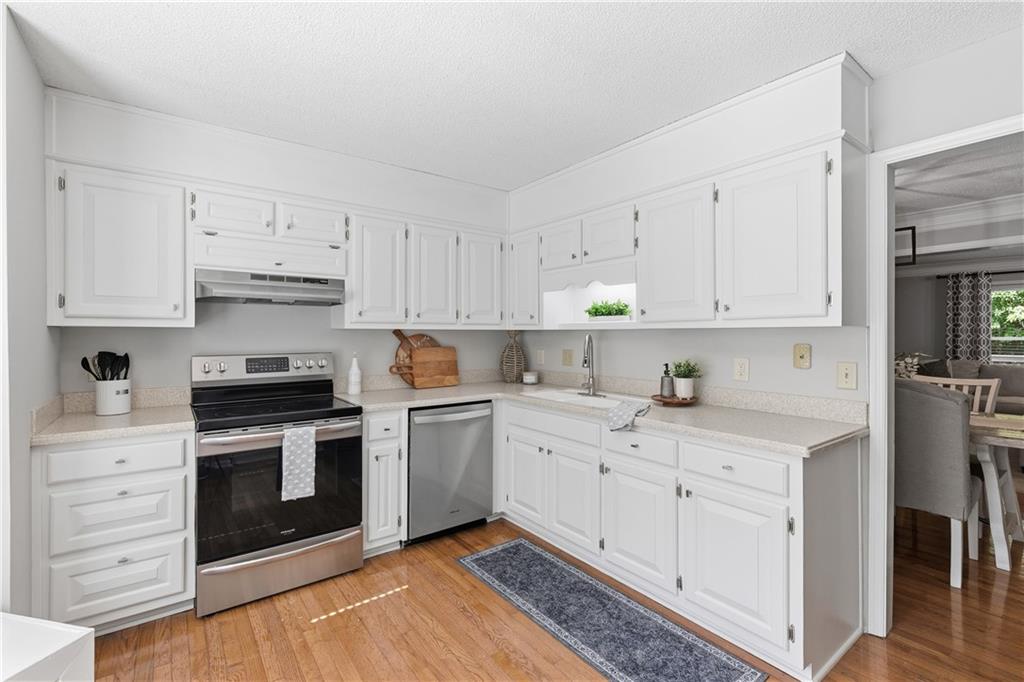 3800 Meeting Street Northwest Duluth, GA 30096 - Photo 13 of 46 a kitchen with cabinets stainless steel appliances and a sink