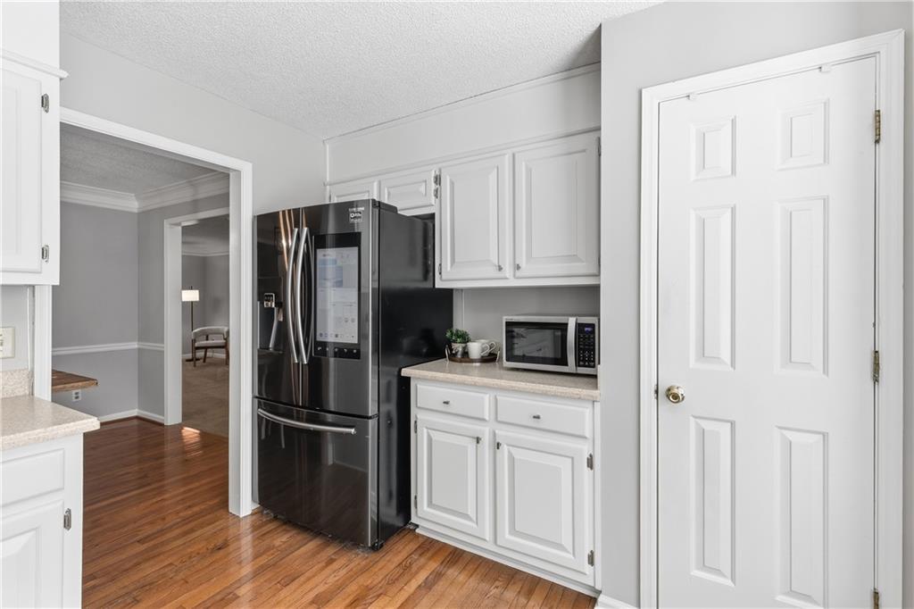 3800 Meeting Street Northwest Duluth, GA 30096 - Photo 16 of 46 a kitchen with stainless steel appliances a refrigerator stove and cabinets