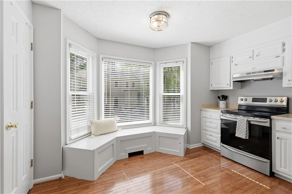 3800 Meeting Street Northwest Duluth, GA 30096 - Photo 17 of 46 a kitchen with a stove a sink and a window