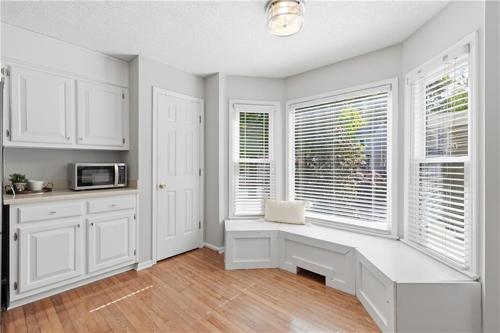 3800 Meeting Street Northwest Duluth, GA 30096 - Photo 18 of 46 a kitchen with white cabinets and a window