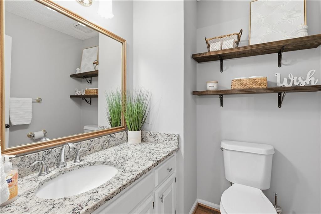 3800 Meeting Street Northwest Duluth, GA 30096 - Photo 19 of 46 a bathroom with a granite countertop sink and a mirror