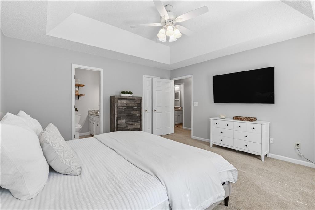 3800 Meeting Street Northwest Duluth, GA 30096 - Photo 22 of 46 a bedroom with a bed tv and dresser