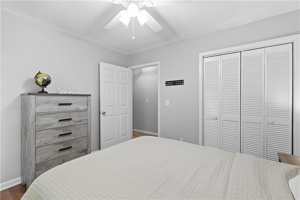 3800 Meeting Street Northwest Duluth, GA 30096 - Photo 25 of 46 a bedroom with a bed and a chandelier