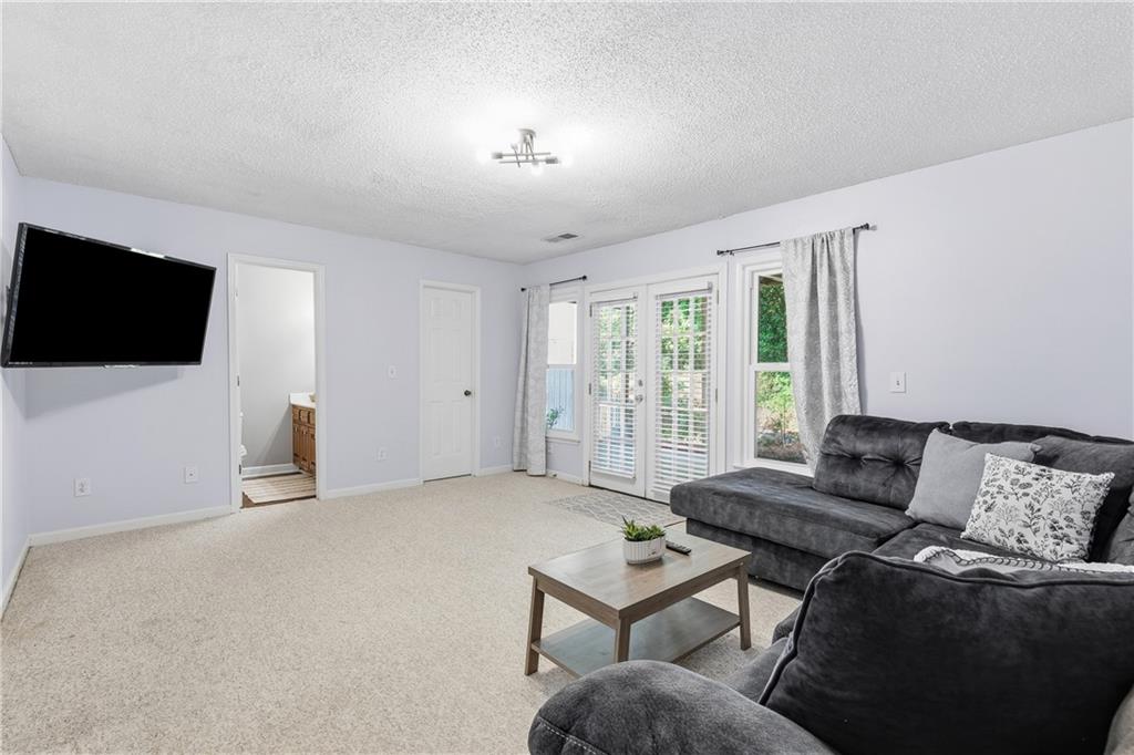 3800 Meeting Street Northwest Duluth, GA 30096 - Photo 34 of 46 a living room with furniture and a flat screen tv