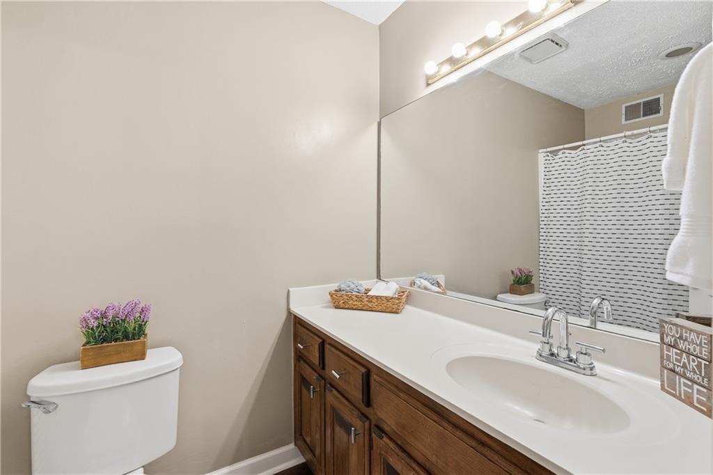 3800 Meeting Street Northwest Duluth, GA 30096 - Photo 36 of 46 a bathroom with a sink vanity mirror and toilet