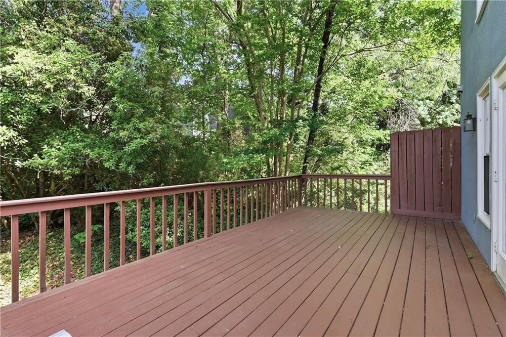 3800 Meeting Street Northwest Duluth, GA 30096 - Photo 40 of 46 a balcony with wooden floor and trees in the back